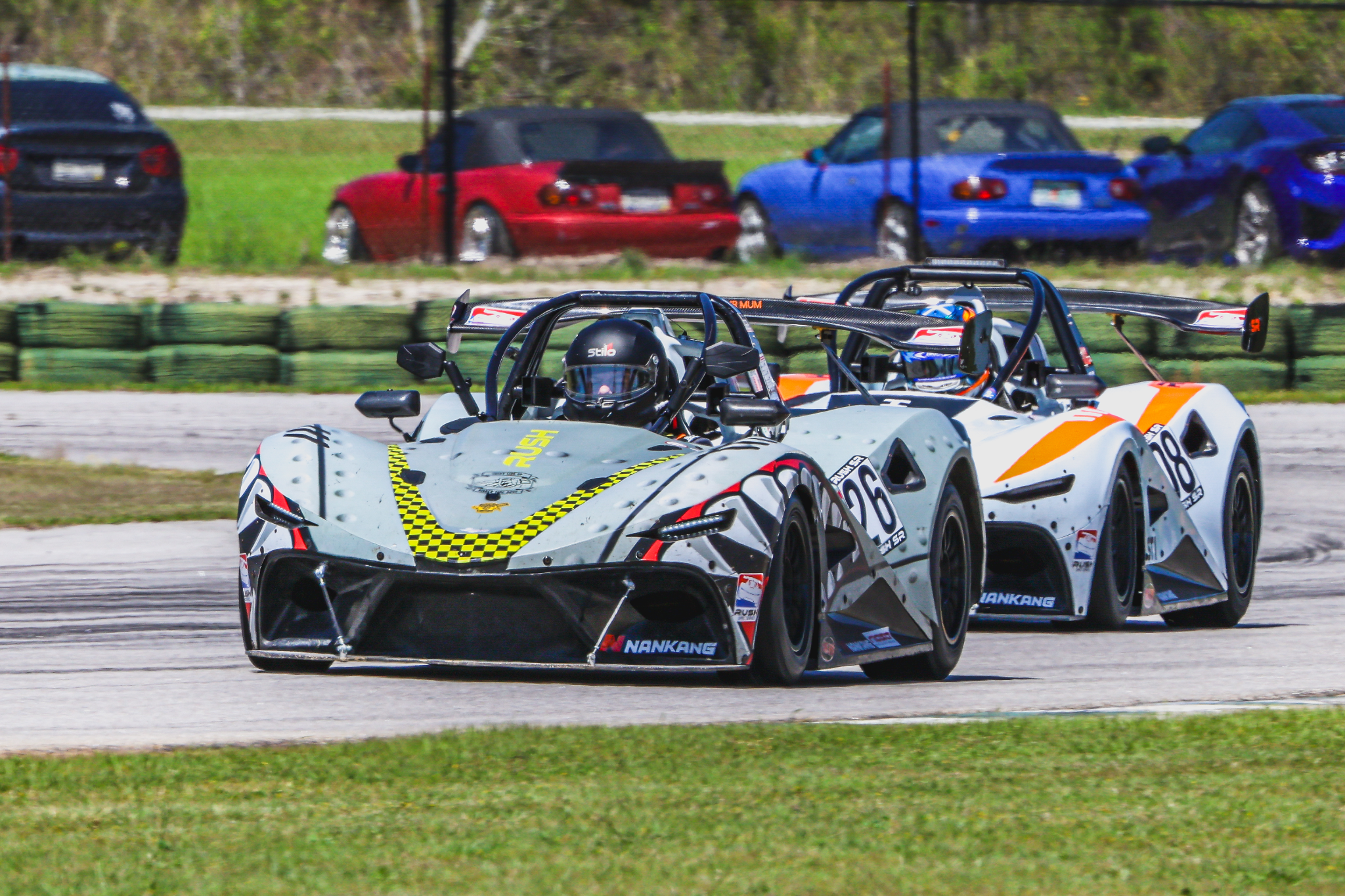 RUSH SR race cars on track